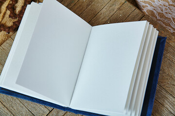 Blank Open Book on Wooden Surface with Vintage Background