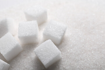 Different types of white sugar as background, closeup. Space for text