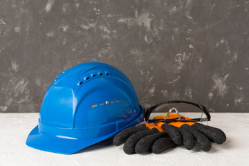 Blue construction equipment on concrete background