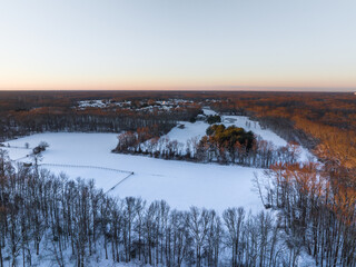 Snow covered rural farm land from an aerial view