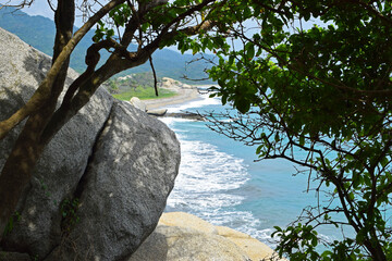 Fototapeta na wymiar A natural frame to the Caribbean Sea with rocks and white sand