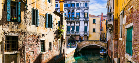 romantic Venetian streets and canals. Bridges of Venice town, Italy - obrazy, fototapety, plakaty
