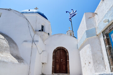 Near Holy Church of the Transfiguration of the Savior, Pyrgos Kallistis village. Greek Islands, Santorini, European Vacation. Travel, holidays, relax, adventure.