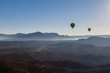 hot air balloon in the mountains