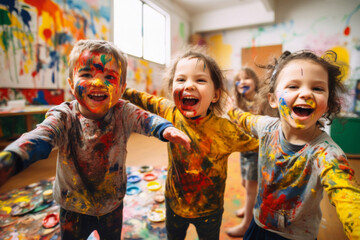 Children smeared with paints in an art school paint pictures - obrazy, fototapety, plakaty