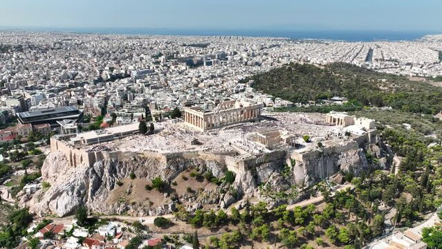 Aerial drone cinematic video above unique Acropolis hill and old historic Plaka district, Athens historic centre, Attica, Greece