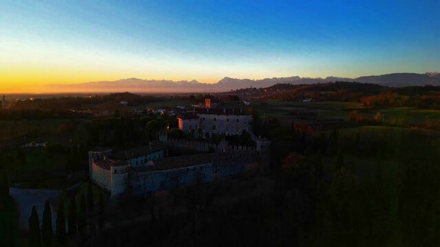 Sunset on the Friulian hills with a view of the Villalta castle. Fagagna.