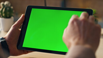 Unknown businessman scrolling chroma key tablet working online at office closeup
