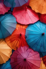 A bunch of colorful umbrellas stacked on top of each other. Perfect for adding a pop of color to any rainy day.