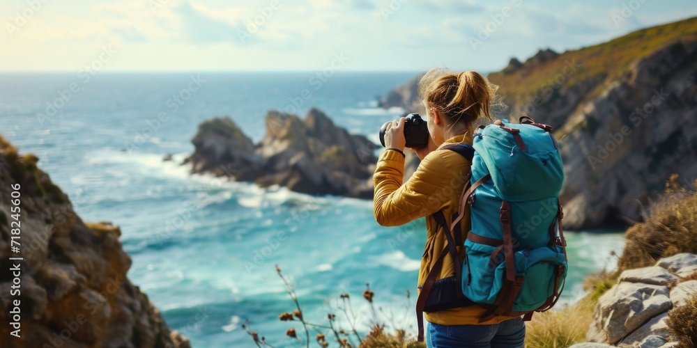 Poster a woman with a backpack capturing a scenic view of the ocean. suitable for travel and adventure them