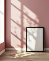 Blank black poster frame with white passe-partout mock up template, room interior in scandinavian style, pink walls, wooden floor and green plant. Ray of sun