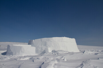 The beginnings of an igloo, a snow shelter from the harsh winter elements. Near Arviat, Nunavut,...