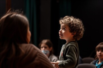 Young Child Confidently Addresses An Attentive Audience From The Stage. Сoncept Public Speaking Skills, Young Child Speaker, Confident Performance, Captivating Audience, Stage Presence