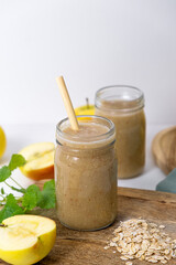 Apple-banana smoothie with oatmeal. Vertical photo