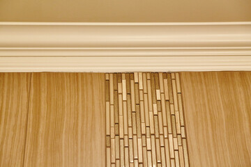 Elegant Interior Design with Geometric Wall Panel and Crown Molding