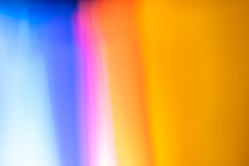 fondo multicolor en naranja y azul de manchas desenfocadas mezclándose sutilmente