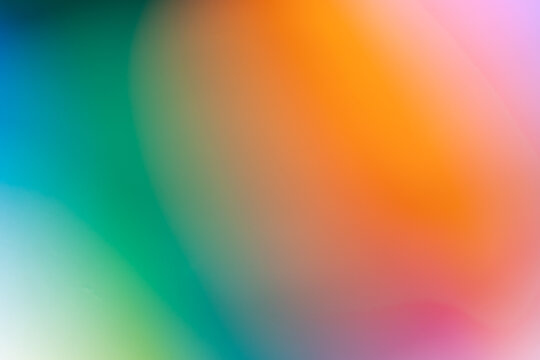 fondo con manchas desenfocadas y degradadas de color verde y naranja