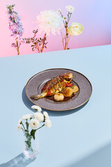 Grilled dorado with mushrooms on a modern ceramic plate, vibrant pink and blue background, ideal for culinary magazines
