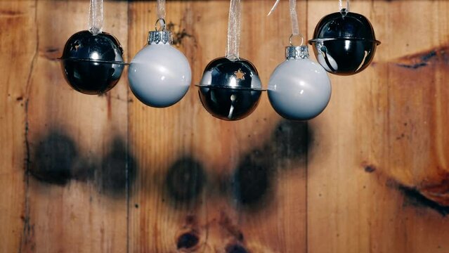 Silver Christmas bells on rustic wooden background