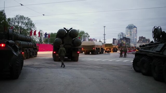 Anti-aircraft missile systems C-300 and armored vehicles are turning through streets