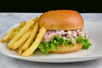 spam salad  sandwich with a side of fries