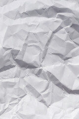 Crumpled white paper background.