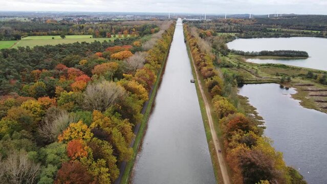 Aerial view of the man-made canal crossing the Hoge Kempen park in East Flanders, Belgium. Autumn season