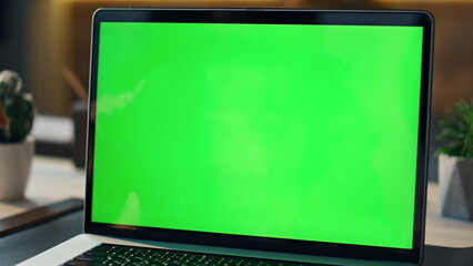 Freelancer speaking green screen laptop at workplace. Manager talking computer 