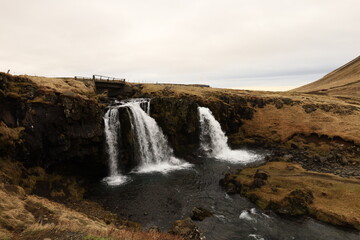 Fototapeta na wymiar Kirkjufellsfossar is a waterfall in West Iceland on the Snæfellsnes peninsula