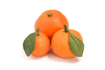 Three fresh organic orange delicious fruit side view with green leaves isolated on white background clipping path