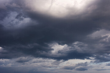 cloudy gloomy evening sky, dramatic storm low clouds