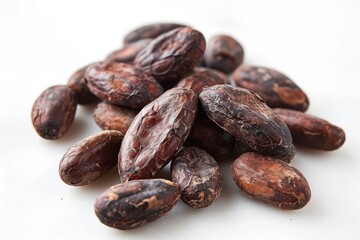 Obraz premium Roasted cocoa beans on white background