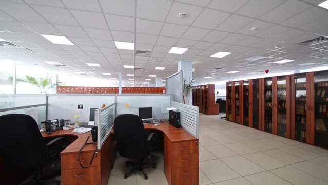 Big office with partitions workplaces and plants in Moscow city telephone network
