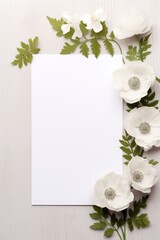 empty white paper mock up and spring anemone flowers