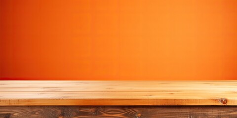 Wooden tabletop contrasting with vibrant orange background