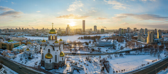 Winter Yekaterinburg and Temple on Blood in beautiful blue clear sunset. Aerial view of Yekaterinburg, Russia. Translation of the text on the temple: Honest to the Lord is the death of His saints.