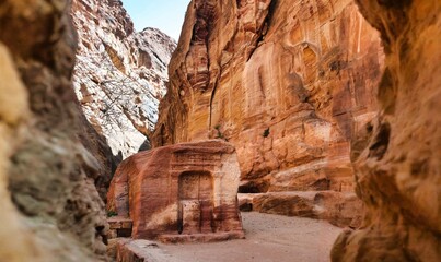 The betils and votive niches visible along the Siq in Petra in Jordan are evidence of the...