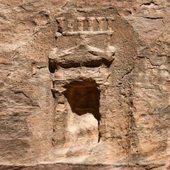 The betils and votive niches visible along the Siq in Petra in Jordan are evidence of the...