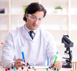 Young male scientist working in the lab
