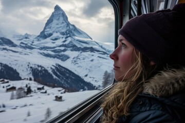 Spellbound tourist on a train, captivated by the snowy Matterhorn's beauty in Zermatt, Switzerland generative ai