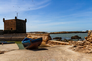 Wooden fishing boat on the waterfront of the old port. Fort Essaouira, Morocco, Africa