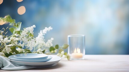  a close up of a plate on a table with a vase of flowers and a lit candle in the background.