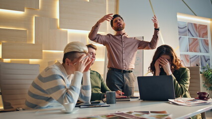 Stressed team disappointed work results in coworking place. Group business fail