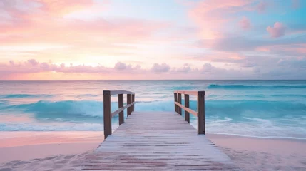 Fototapeten  a wooden pier leading to the ocean with waves crashing on the shore and a pink and blue sky in the background. © Anna