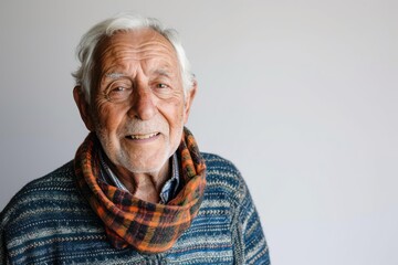 Happy senior man looking at camera on white background
