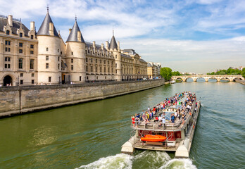 Cruise boat sailing along Seine river in Paris, France