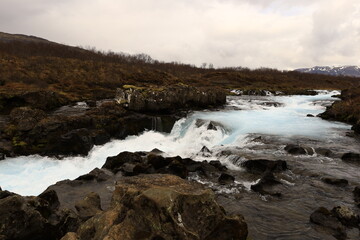 Brúará is a spring-fed river in West Iceland which runs by the boundaries of municipalities Biskupstungur and Grímsnes