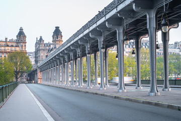 Long row of metal columns of elevated subway. Bir Hakeim Bridge in Paris, France