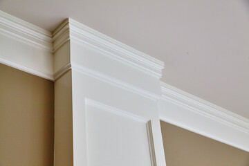 Elegant Crown Molding and Door Frame in Sophisticated Interior, Upward View