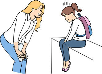 Woman teacher supports and motivates sad child who has problems with socialization